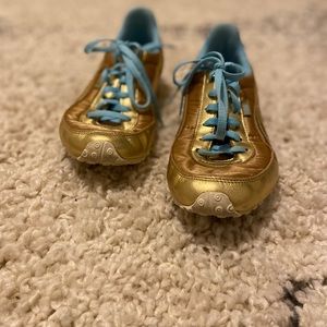 Gold Puma Trainers